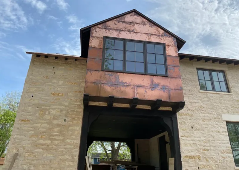 Copper metal panel facade on a stone building for Metal Roof Coating in Guilderland